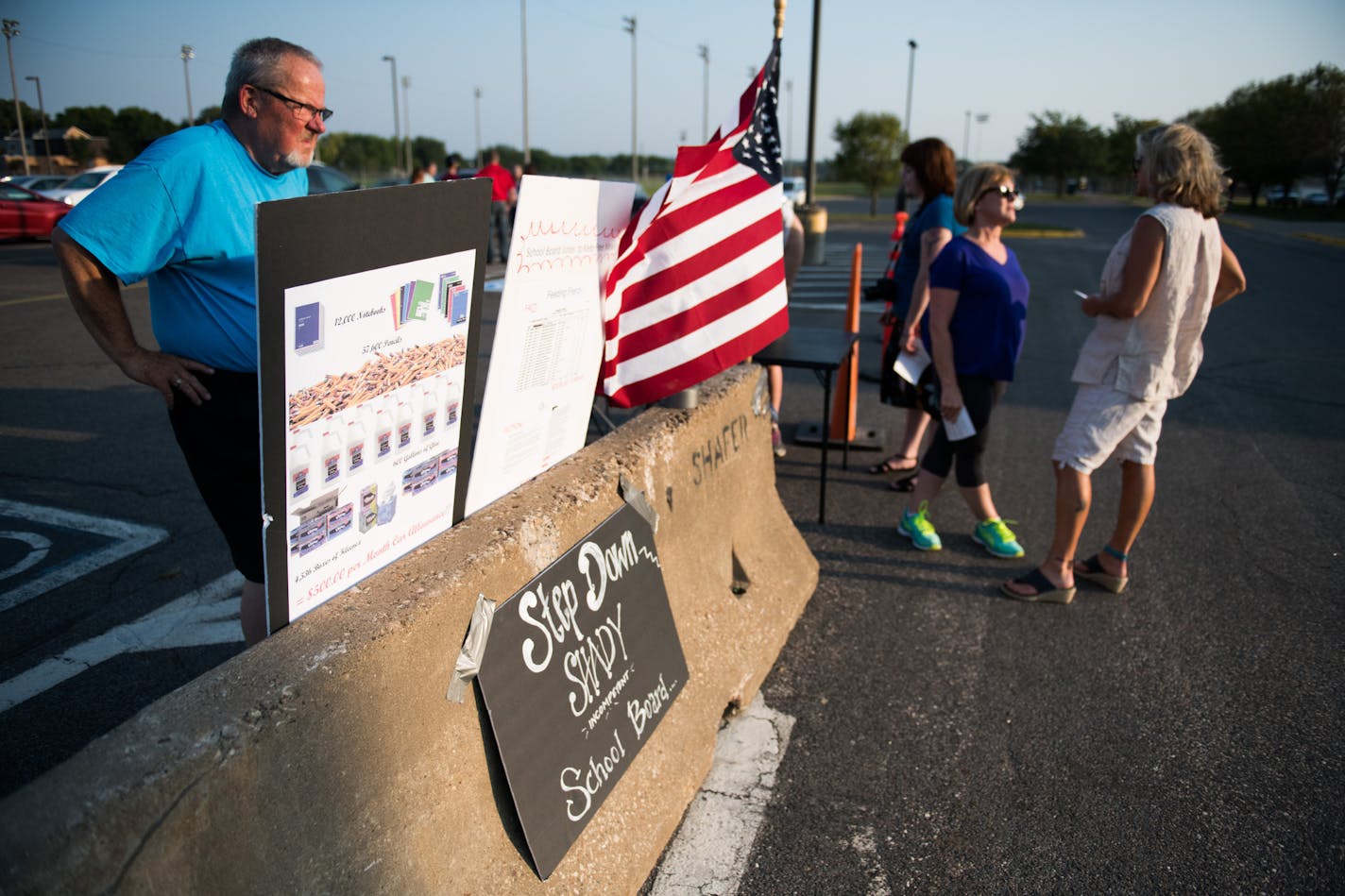 Curt Olson erected poster boards in the parking lot outside the school. ] MARK VANCLEAVE &#xef; mark.vancleave@startribune.com * Members of FACT: Friends & Concerned TaxPayers of Shakopee gathered outside a Shakopee Schools meeting at Shakopee West Junior High on Thursday, Sept. 14, 2017. They believe school board members were negligent or complicit in overspending by former superintendent Rod Thompson.