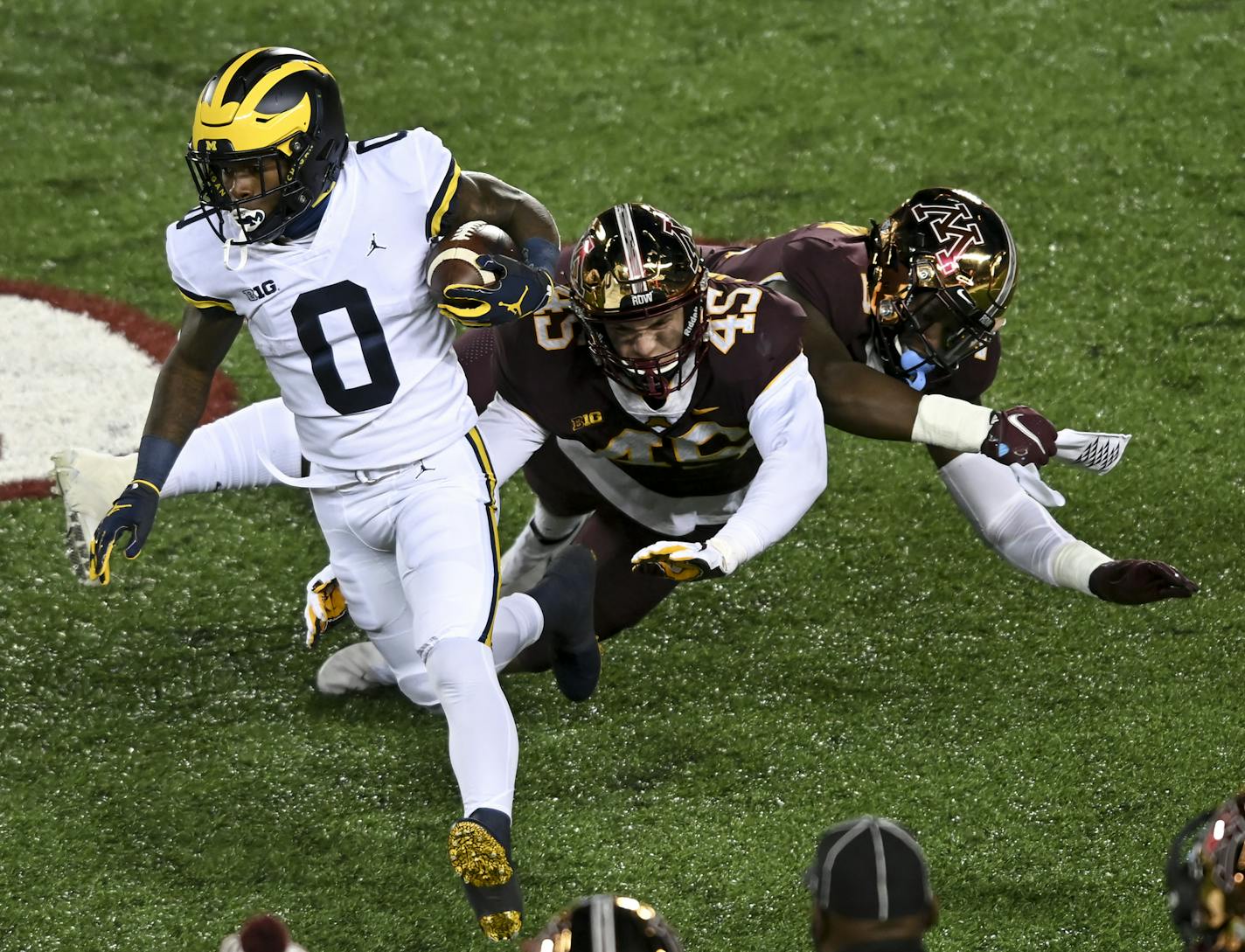 Minnesota Gophers defensive lineman MJ Anderson (3) and linebacker Cody Lindenberg (45) collided as they missed a tackle against Michigan Wolverines wide receiver Giles Jackson (0) as he ran for a first down in the second quarter. ] AARON LAVINSKY • aaron.lavinsky@startribune.com The Minnesota Gophers played the Michigan Wolverines on Saturday, Oct. 24, 2020 at TCF Bank Stadium in Minneapolis, Minn.