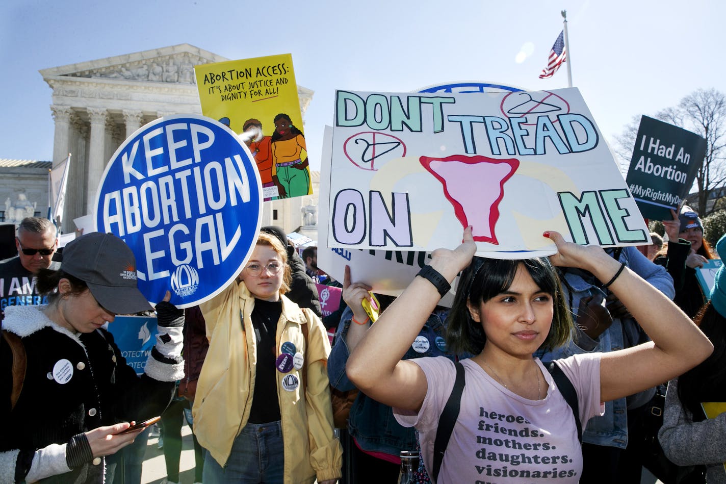 FILE - In this Wednesday, March 4, 2020 file photo, abortion rights demonstrators rally outside the Supreme Court in Washington. A federal appeals court panel ruled that medication abortions, in which pills are taken to terminate a pregnancy, can be provided in Texas during the coronavirus pandemic. In a ruling Monday, April 13, 2020, a three-judge panel of the 5th U.S. Circuit Court of Appeals said that medication abortions can go forward. (AP Photo/Jacquelyn Martin File)