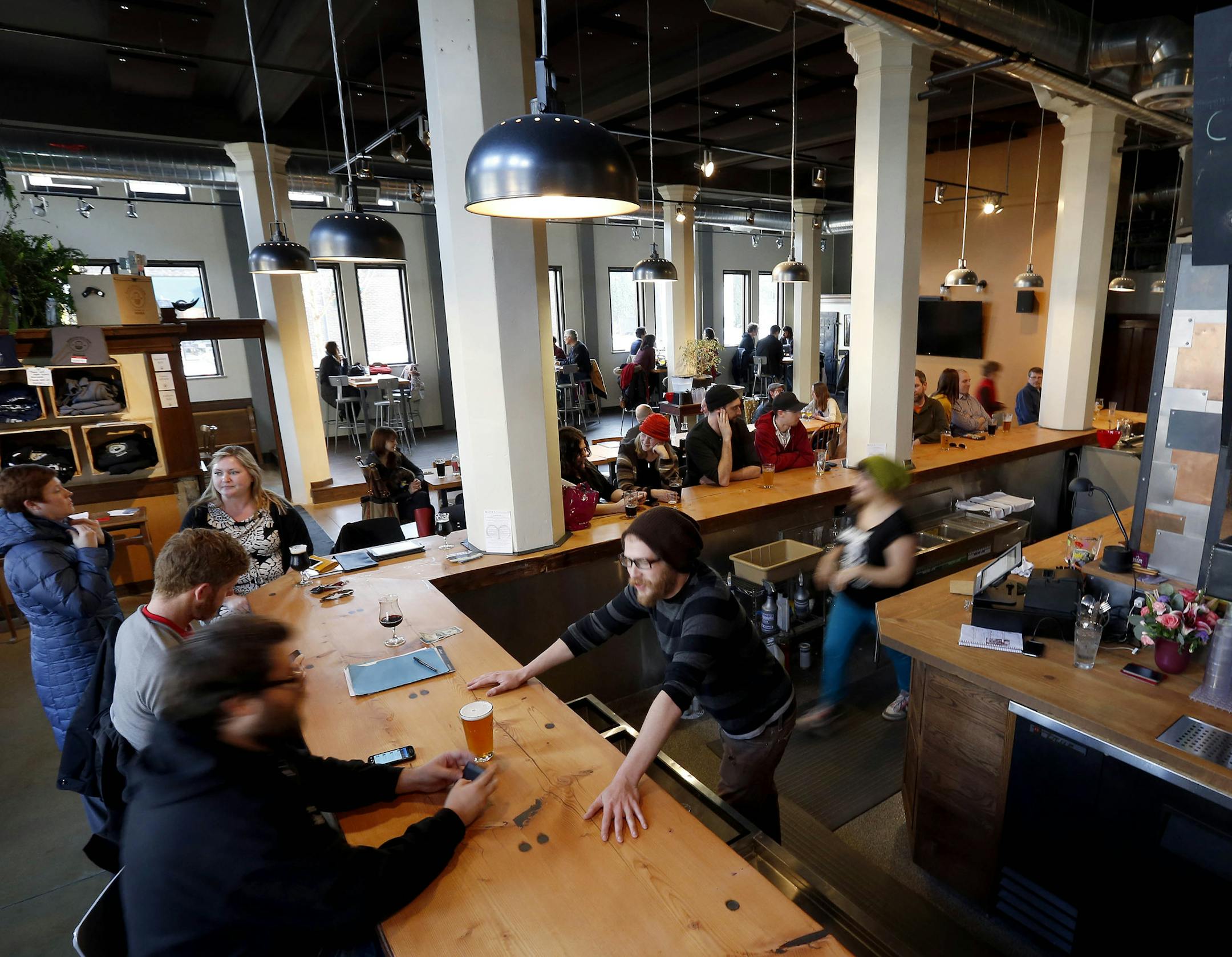 Patrons had beers at Dangerous Man Brewing Co. in Northeast Minneapolis. ] CARLOS GONZALEZ cgonzalez@startribune.com - March 14, 2013, Big Three northeast taprooms in Minneapolis, Indeed, 612 Brew, Dangerous Man