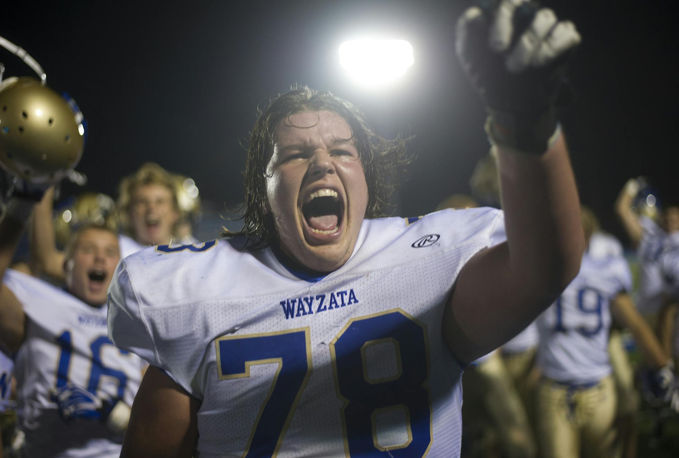 Wayzata's Nick Pedote joins his teammates in celebration after defeating Minnetonka at home 31-28 Friday, October, 24, 2014. ] (Matthew Hintz, 102414, Minnetonka)
