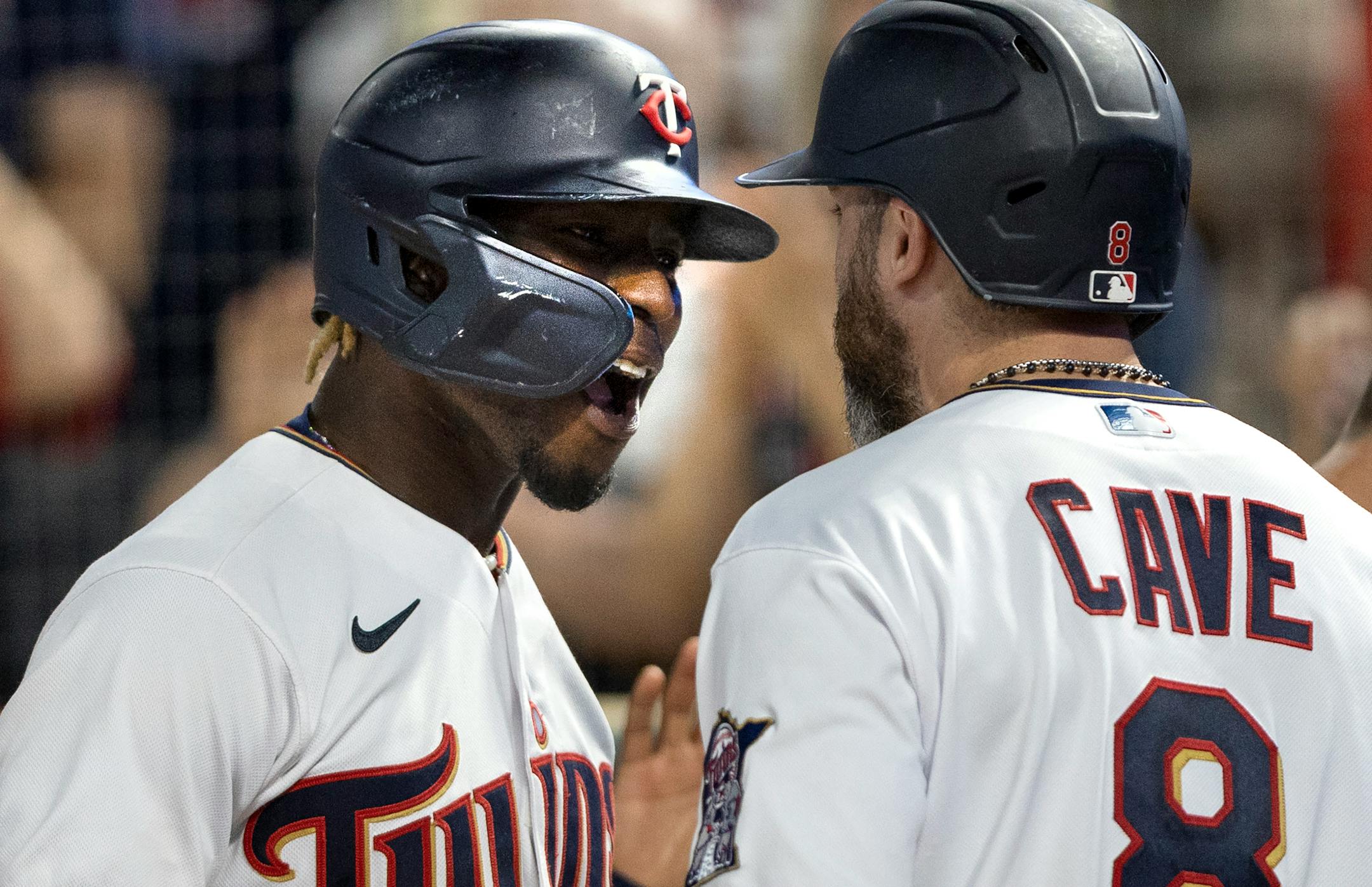Nick Gordon of the Minnesota Twins celebrates with teammates after hitting a grand slam home run in the fifth inning.