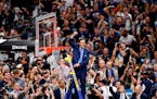 Villanova head coach Jay Wright reacts after cutting down the net after beating Michigan 79-62 in the championship game of the Final Four in San Anton