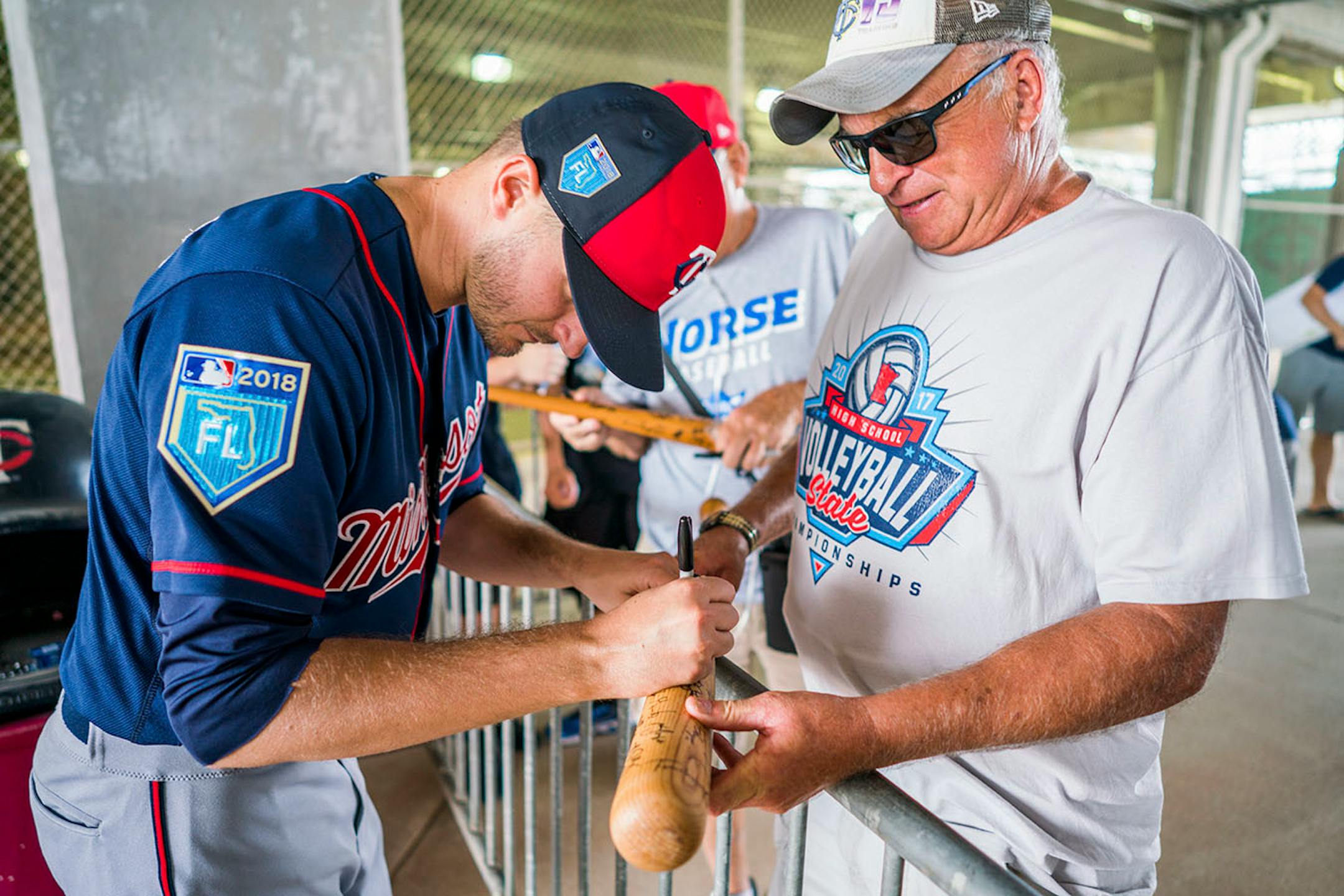 Twins pitcher Jake Odorizzi (12) signed a bat for Terry Finley of Finland, Minn.