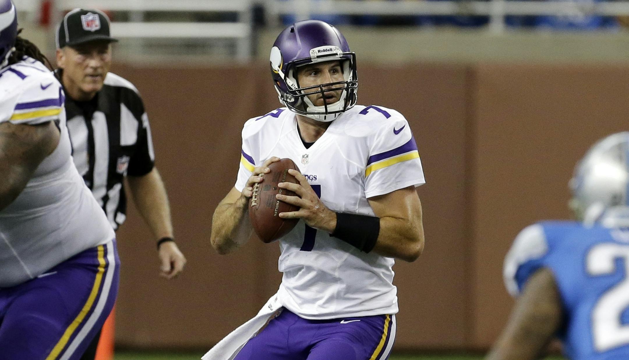 Minnesota Vikings quarterback Christian Ponder (7) looks to pass during the third quarter of an NFL football game against the Detroit Lions at Ford Field in Detroit, Sunday, Sept. 8, 2013. (AP Photo/Paul Sancya) ORG XMIT: MIN2013091318460085