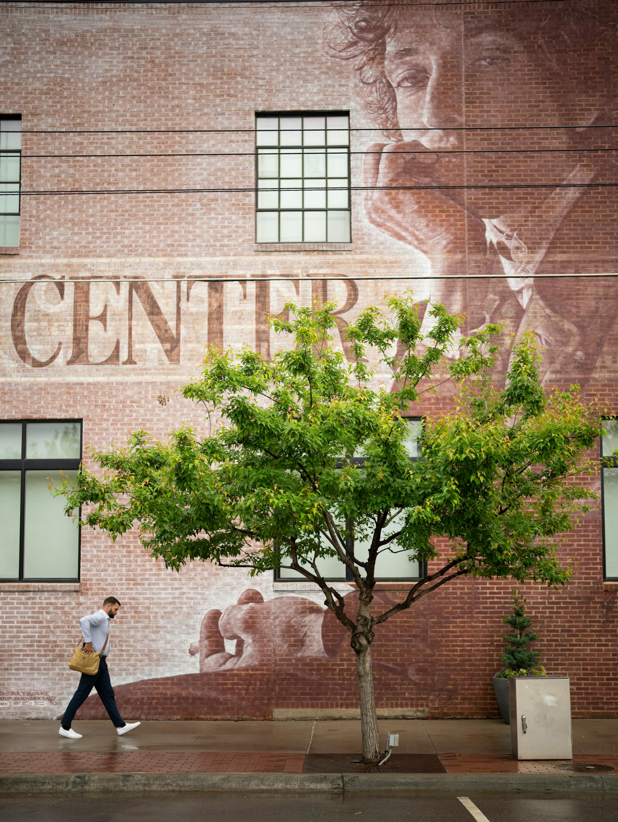 The exterior of the Bob Dylan Center, which features a mural based on a 1965 photograph by Jerry Schatzberg.