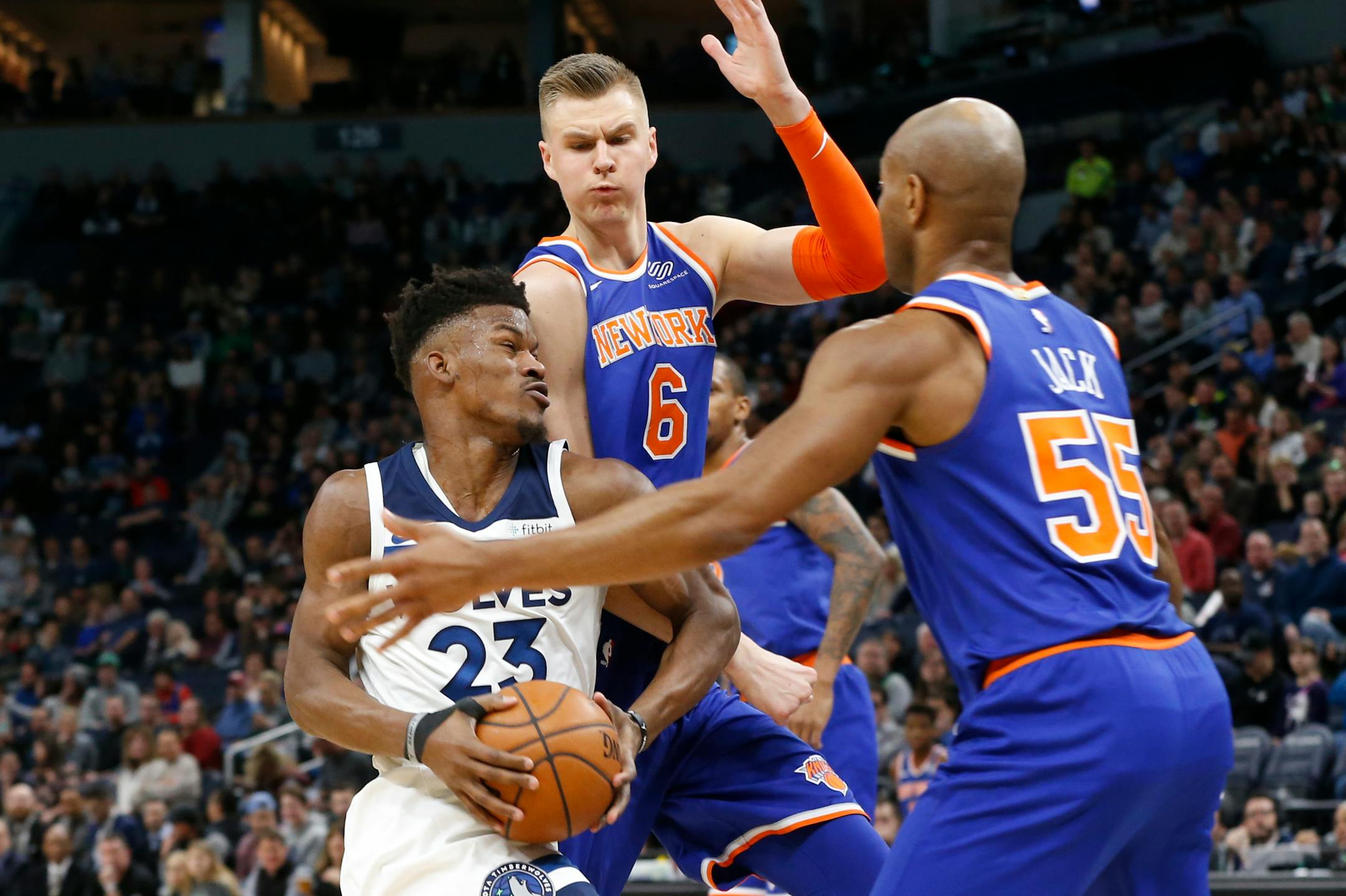Minnesota Timberwolves' Jimmy Butler, left, tries to get between New York Knicks' Kristaps Porzingis, of Latvia, and Jarrett Jack, right, in the first half of an NBA basketball game Friday, Jan. 12, 2018, in Minneapolis. (AP Photo/Jim Mone)