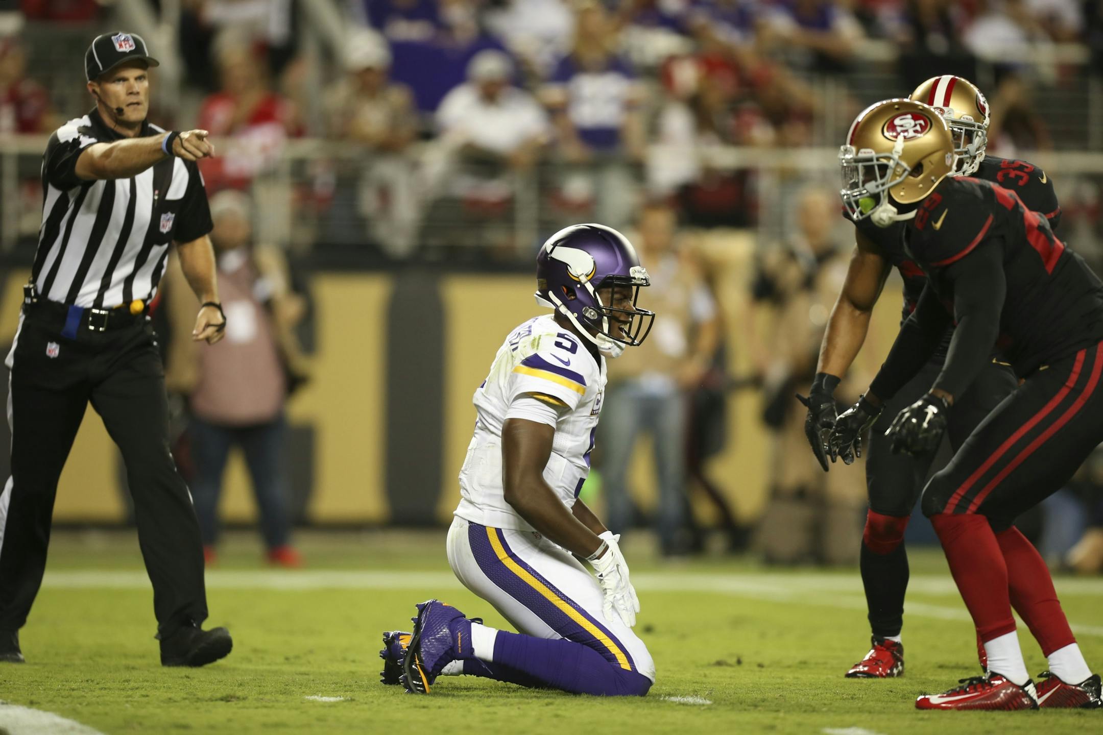 Vikings quarterback Teddy Bridgewater (5) was sacked for a 14 yard loss by San Francisco 49ers strong safety Jaquiski Tartt, right, in the first quarter Monday night.
