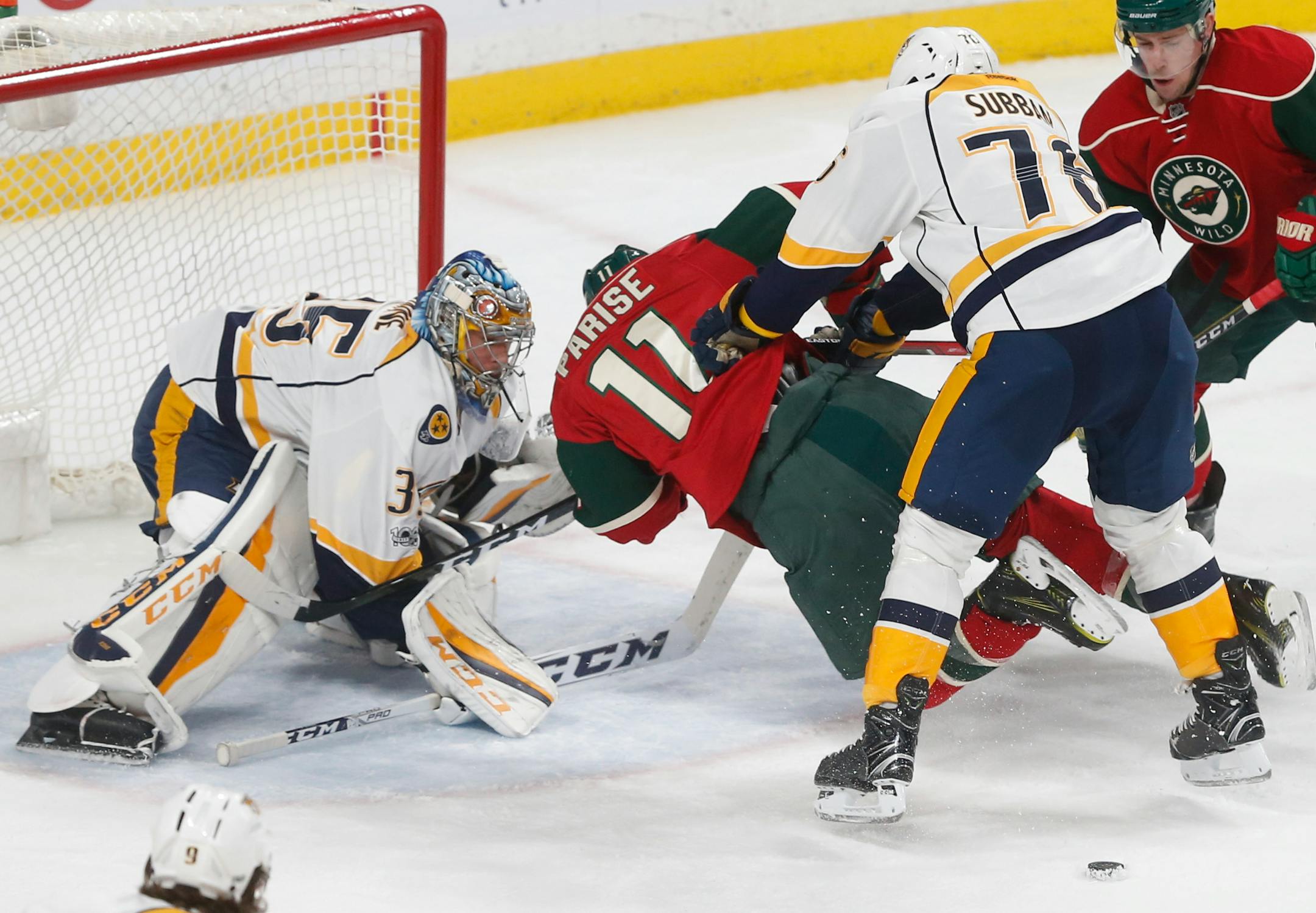 Nashville Predators' P.K. Subban, right, pushes down Minnesota Wild's Zach Parise last Saturday.
