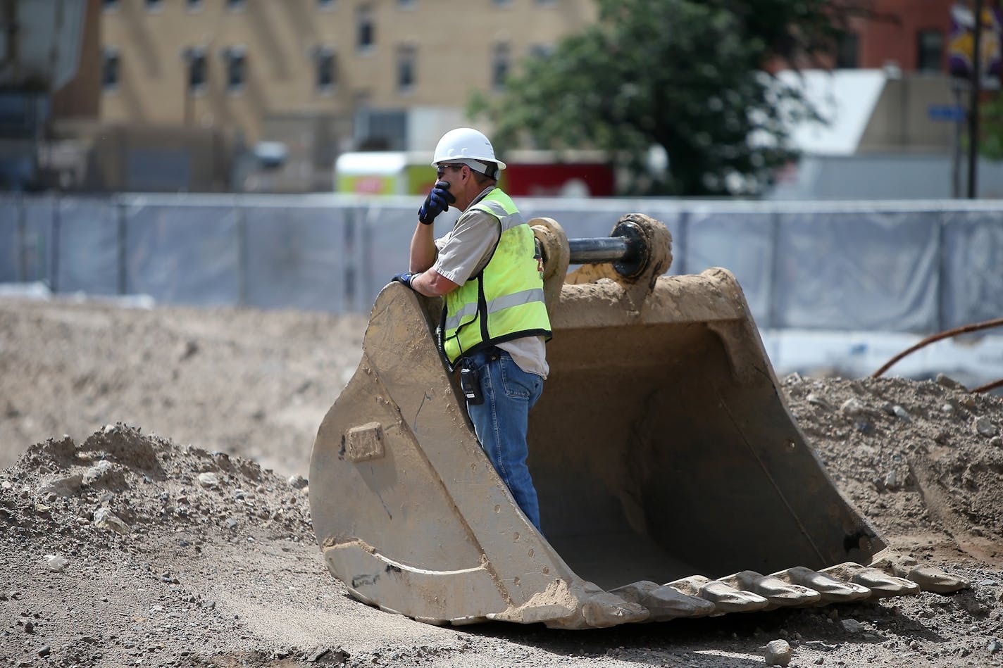 Dave Mansell, the general superintendent of Mortenson, watched as the largest crane was being hauled into the construction site of the Vikings stadium on June 30.