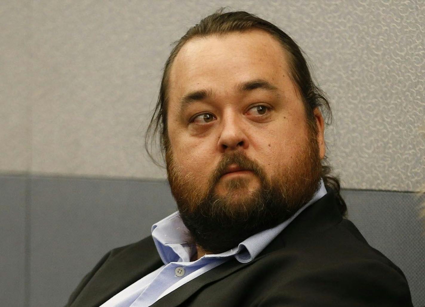 Austin Lee Russell, better known as Chumlee from the TV series "Pawn Stars," appears in court Monday, May 23, 2016, in Las Vegas. Russell and his lawyers told a Las Vegas judge he intends to plead guilty in state court to felony weapon and misdemeanor attempted drug possession charges.