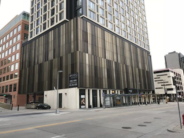 4Marq apartments, on Marquette Avenue, feature a screen over several floors of parking.