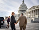 Holding hands with her husband Archie, Senator Tina Smith walked toward the U.S. Capitol building in the morning sun for her swearing in ceremony.
