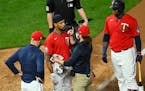 Byron Buxton was checked for a concussion after being struck by a pitch in the bottom of the eighth inning Friday.