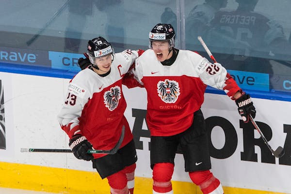 Team captain Marco Rossi (left) celebrated after Senna Peeters (right) scored the Austrians’ only goal of the World Junior Championships on Tuesday 