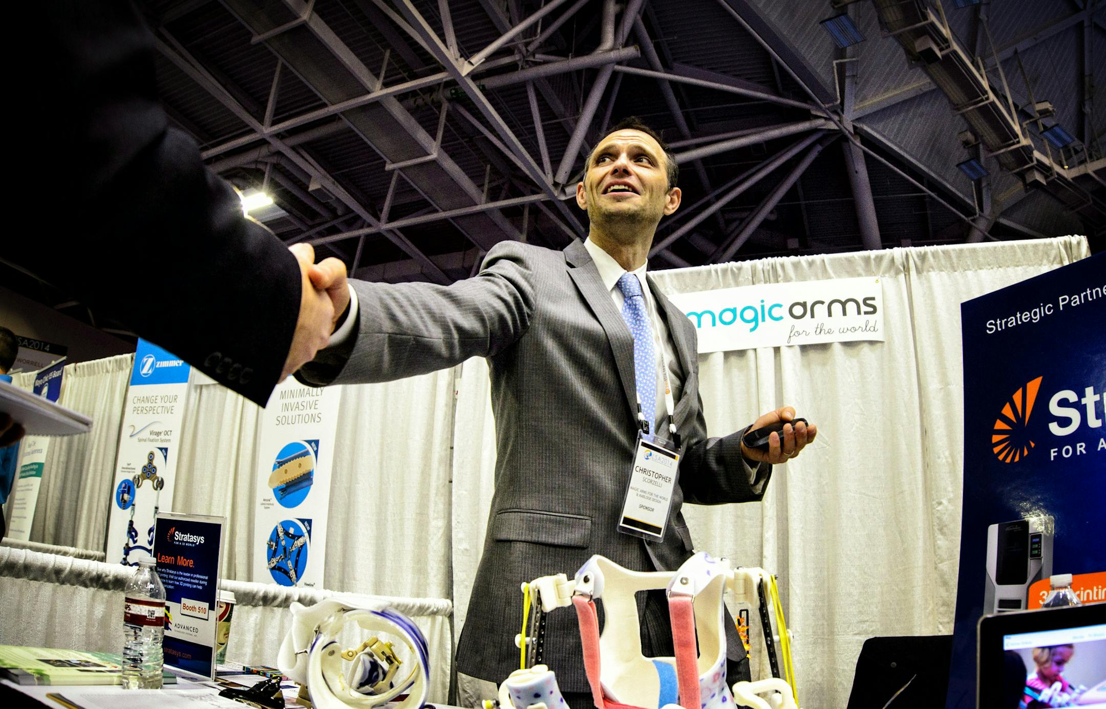 Christopher Scorzelli, director of Magic Arms greeted attendees at LifeScience Alley's one-day conference in the Minneapolis convention center. ] GLEN STUBBE * gstubbe@startribune.com