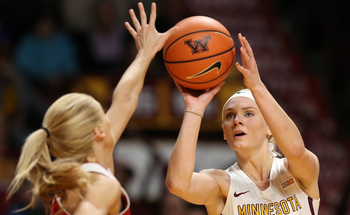 Minnesota's Carlie Wagner (33) hits a 3-pointer over Indiana's Tyra Buss at Williams Arena in Minneapolis on Tuesday, Feb 20, 2018. Indiana won, 82-70. (Jerry Holt/Minneapolis Star Tribune/TNS)