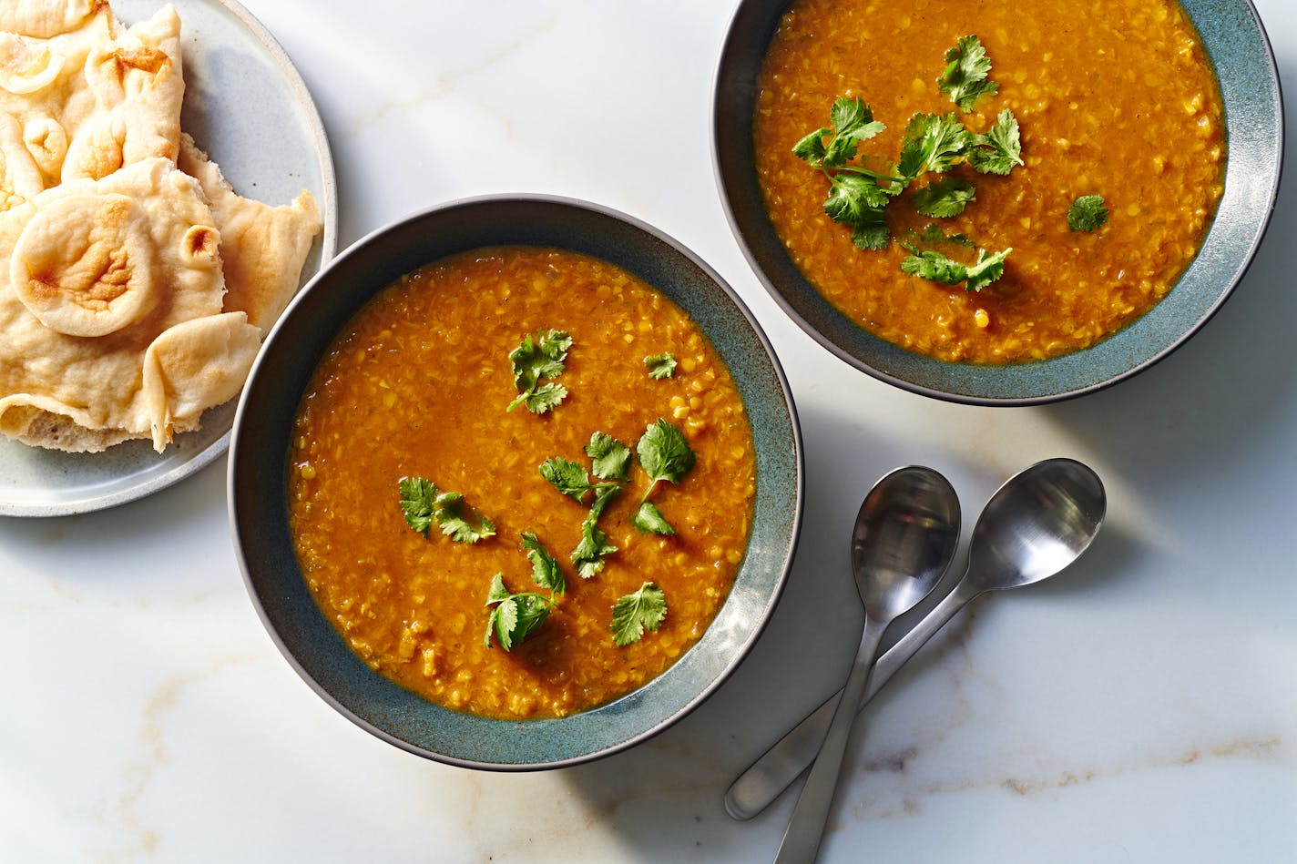 FILE — Dal Adas (Spicy Red Lentil Tamarind Soup). Soup is the perfect vessel for a number of 2024 food trends. (Joe Lingeman/The New York Times. Food Stylist: Barrett Washburne)