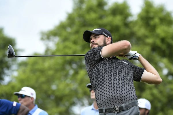 Former Spring Lake Park and Winona State golfer Troy Merritt teed off on the 18th hole during last year's 3M Open.