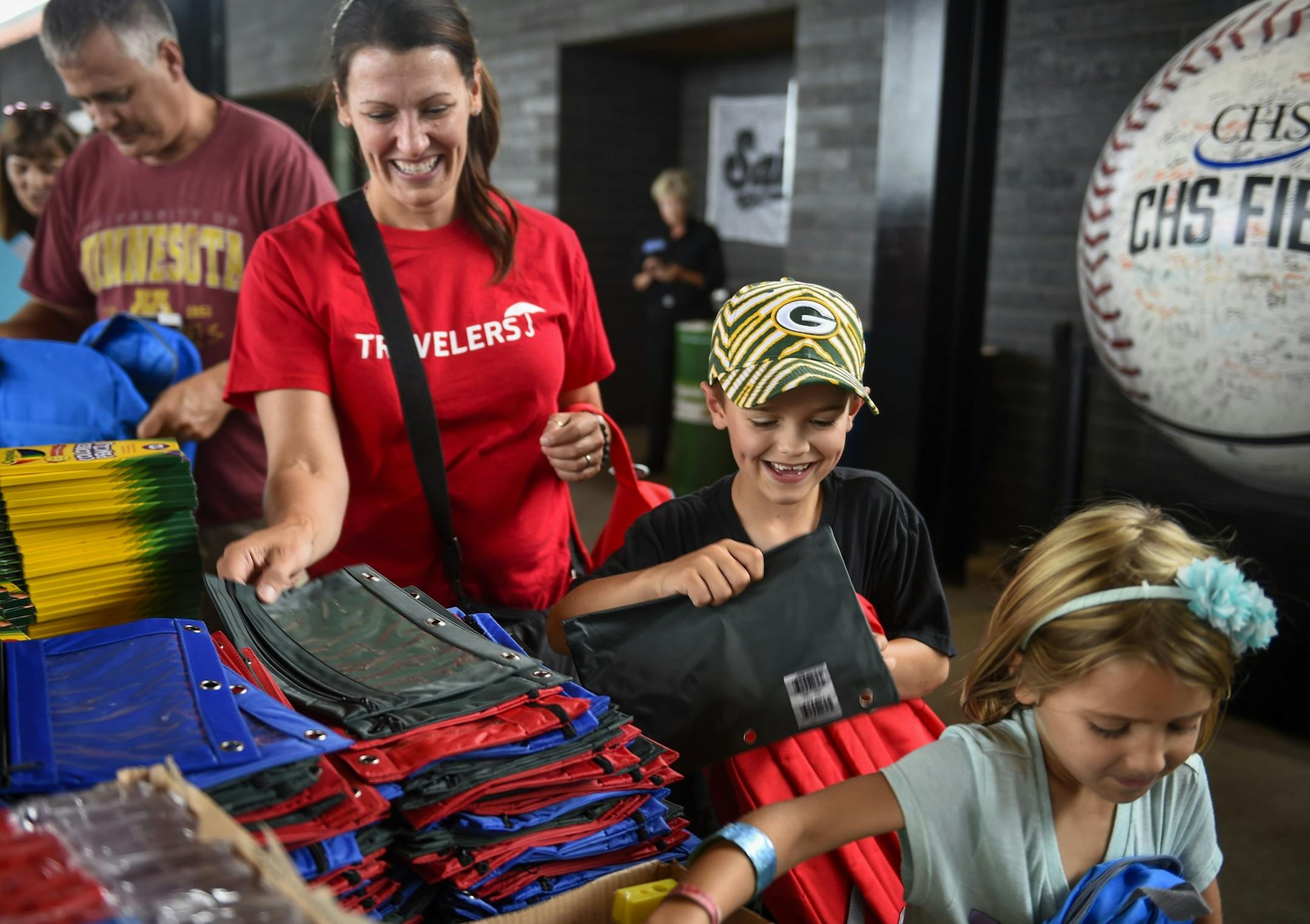 Volunteers of all ages fill 12,000 backpacks for Greater Twin Cities United Way's Action Day in August 2017. At this year's Action Day on Aug. 9, the charity is doubling their efforts to 25,000 backpacks to be distributed to needy kids.
photo courtesy Greater Twin Cities United Way