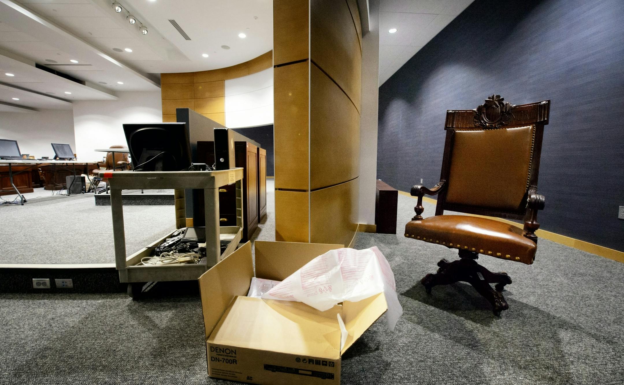 The Senate President's chair sits behind the scenes, waiting to be used.
