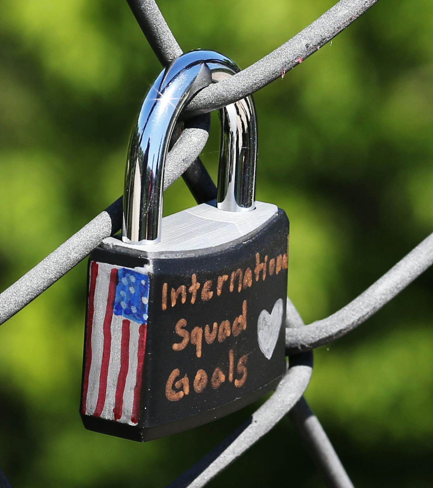 A closeup of the words and flag adorning a lock placed on the Vermillion Gorge Bridge in Hastings by friends Sidney Cater, right, and Emily Meyer, both 15, from Hastings. The bridge grows heavier by the day and was seen Tuesday, June 21, 2016, in Hastings, MN. The one they added was also a tribute to their new friend Adrianna Mendyka, 17, who had recently left after being an exchange student from Poland in Hastings.](DAVID JOLES/STARTRIBUNE)djoles@startribune The Vermillion Gorge Bridge in Hasti