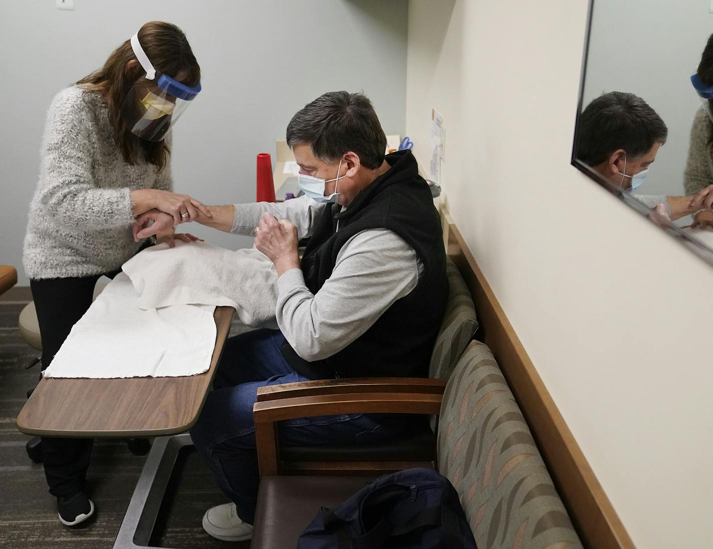 A rough road ahead Greg Beaudoin worked with occupational therapist Patty Carroll at M Health Fairview Clinic in Woodbury.