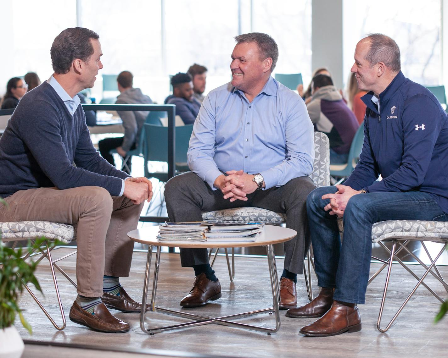 Bob Biesterfeld, chief executive of Eden Prairie-based C.H. Robinson Worldwide, middle, meets with colleagues Pat Nolan, left, and Jerry Hoffman, at the company's Chicago office last month.