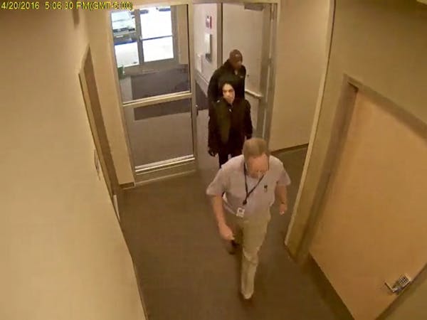 COURTESY CARVER COUNTY. Surveillance video of Prince entering Dr. Schulenberg's clinic on April 20, 2016. Kirk Johnson is behind Prince.