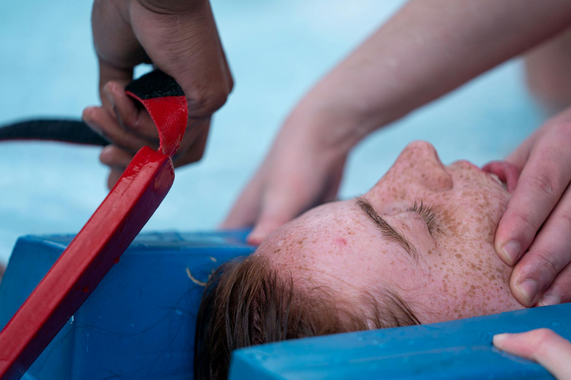 Lifeguard-in-training Riya Chattopadhyay acts as a victim during a rescue exercise while in a training program for new Ramsey County lifeguards.