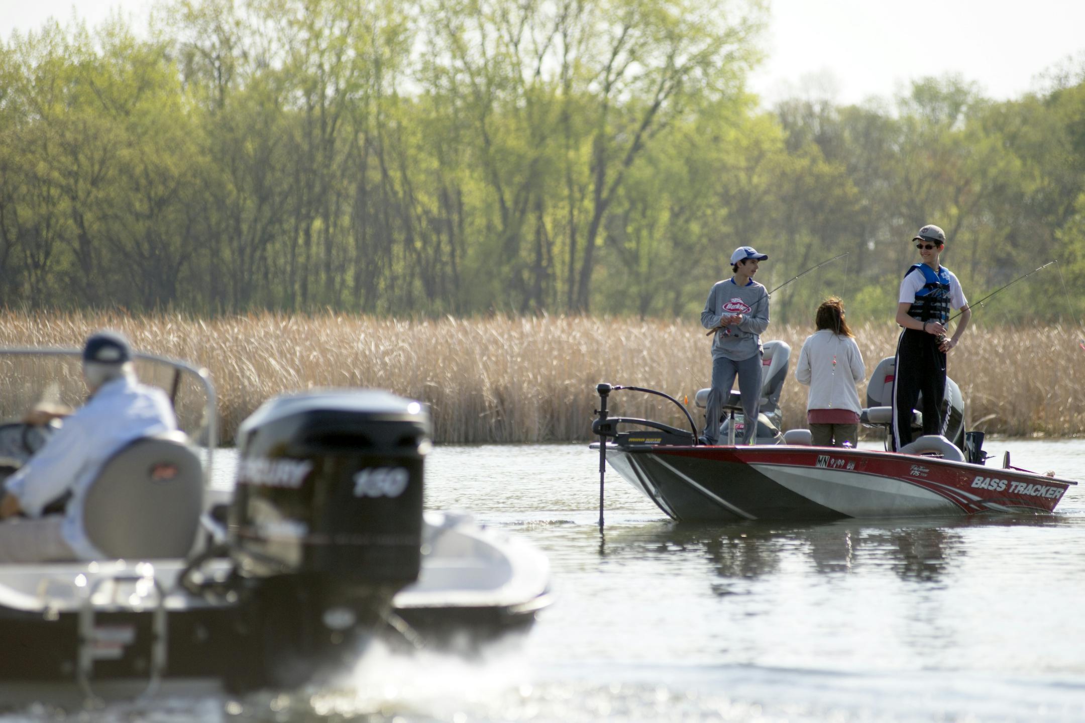 Randall Deming, Mari Glenn and Solomon Glenn, left to right, fish for crappies as they troll through Emerald Bay on Lake Minnetonka early Saturday, May 2, during the 2015 Lake Minnetonka Crappie Contest hosted at Lord Fletcher's in Orono, MN. ] (Matthew Hintz, Orono, 050215)