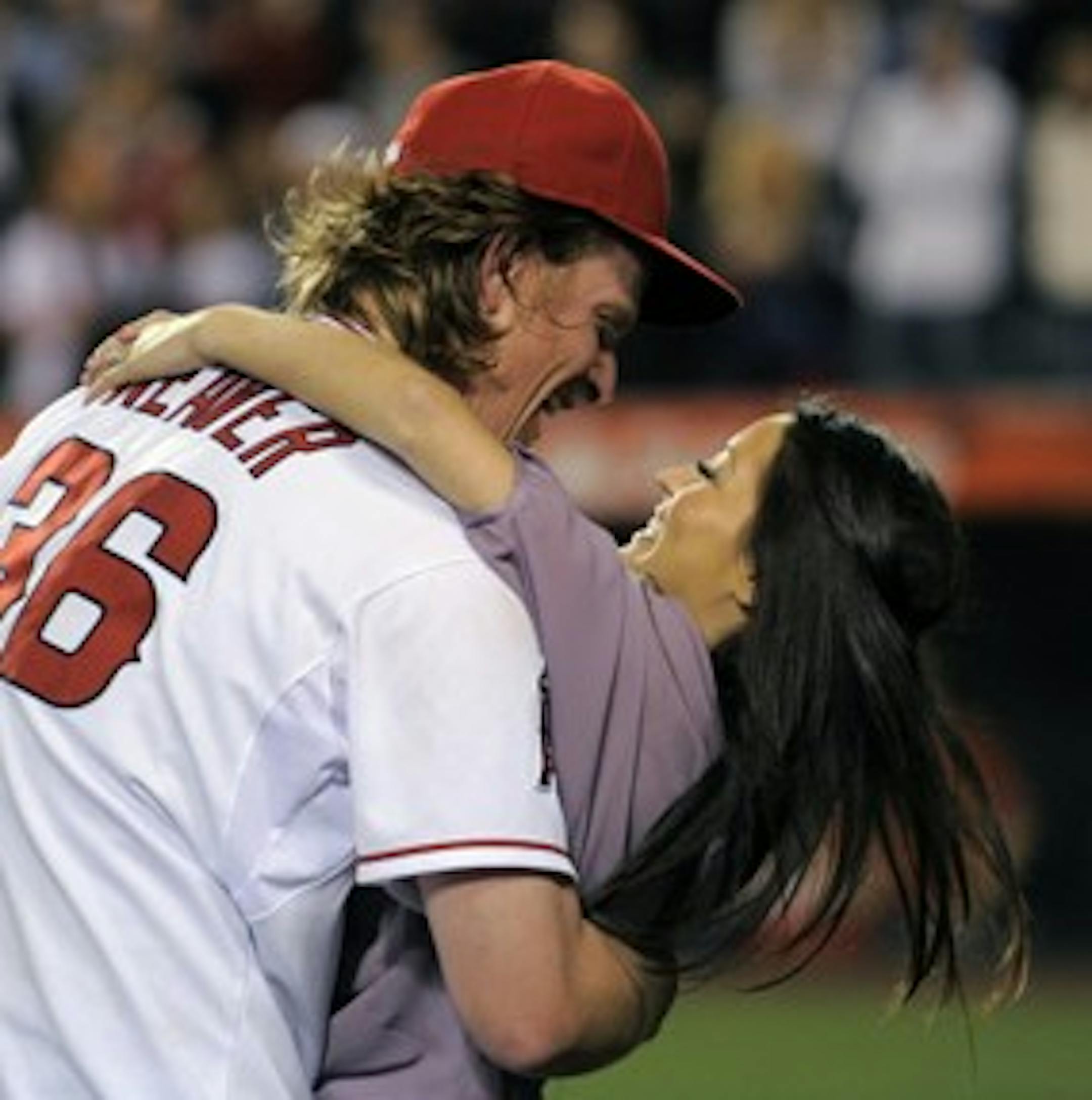 Weaver embraces an enthusiastic fan -- his wife, Kristin.