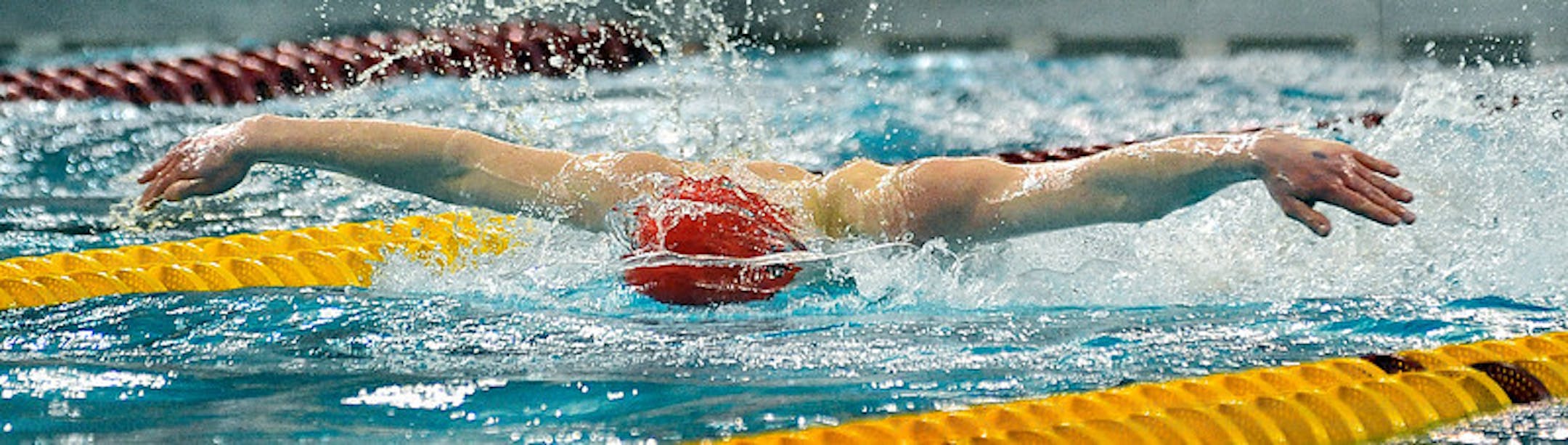 Eden Prairie's Joshua Withers competing in the 100 butterfly at the University of Minnesota Aquatic Center.