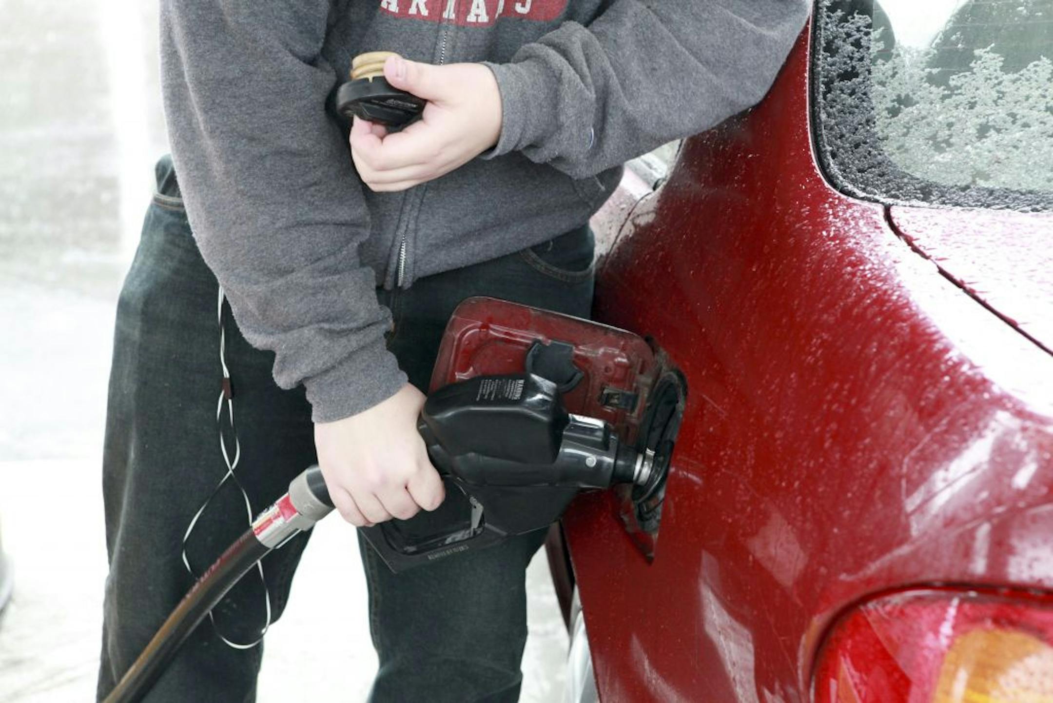 A motorist pumps gas at a Shell station in Millwood, N.Y., Feb. 29, 2012. As the Obama administration steps up pressure on India, China and Turkey to cut imports of Iranian oil, energy experts are warning that the daily drumbeat of threats and counter-threats with Tehran could push gasoline prices this summer to more than $5 a gallon and jeopardize the economic recovery.