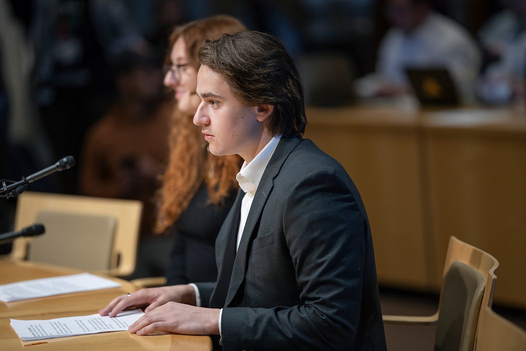 Alex Stewart, outgoing Minnesota Hillel President, left, and Charlie Maloney, incoming President, right, address the University of Minnesota Board of Regents during their meeting in Minneapolis on Friday.