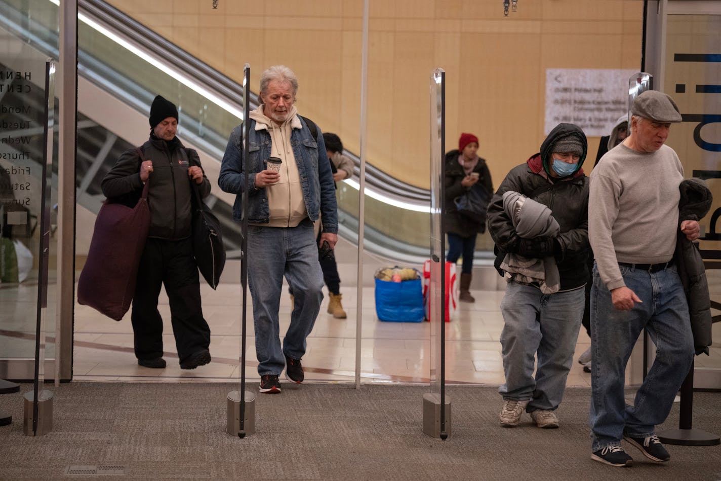 People waited to enter the Central Library 9 am Thursday January ,4, 2024 in, Minneapolis, Minn. ] JERRY HOLT • jerry.holt@startribune.com