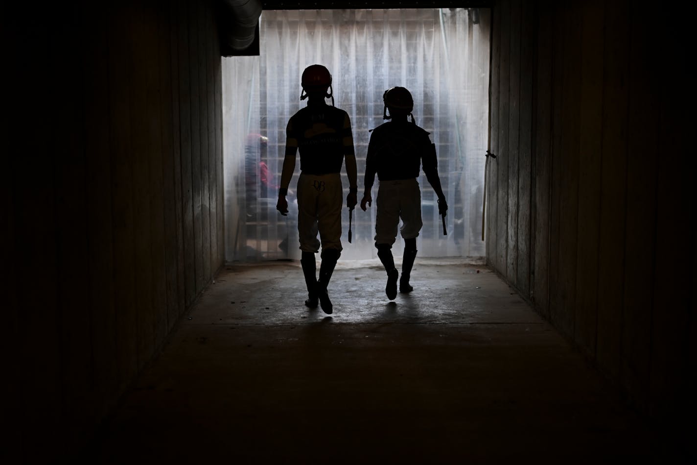 jockeys walk out to the paddocks Wednesday, Aug. 16, 2023 at Canterbury Park in Shakopee, Minn. ] AARON LAVINSKY • aaron.lavinsky@startribune.com