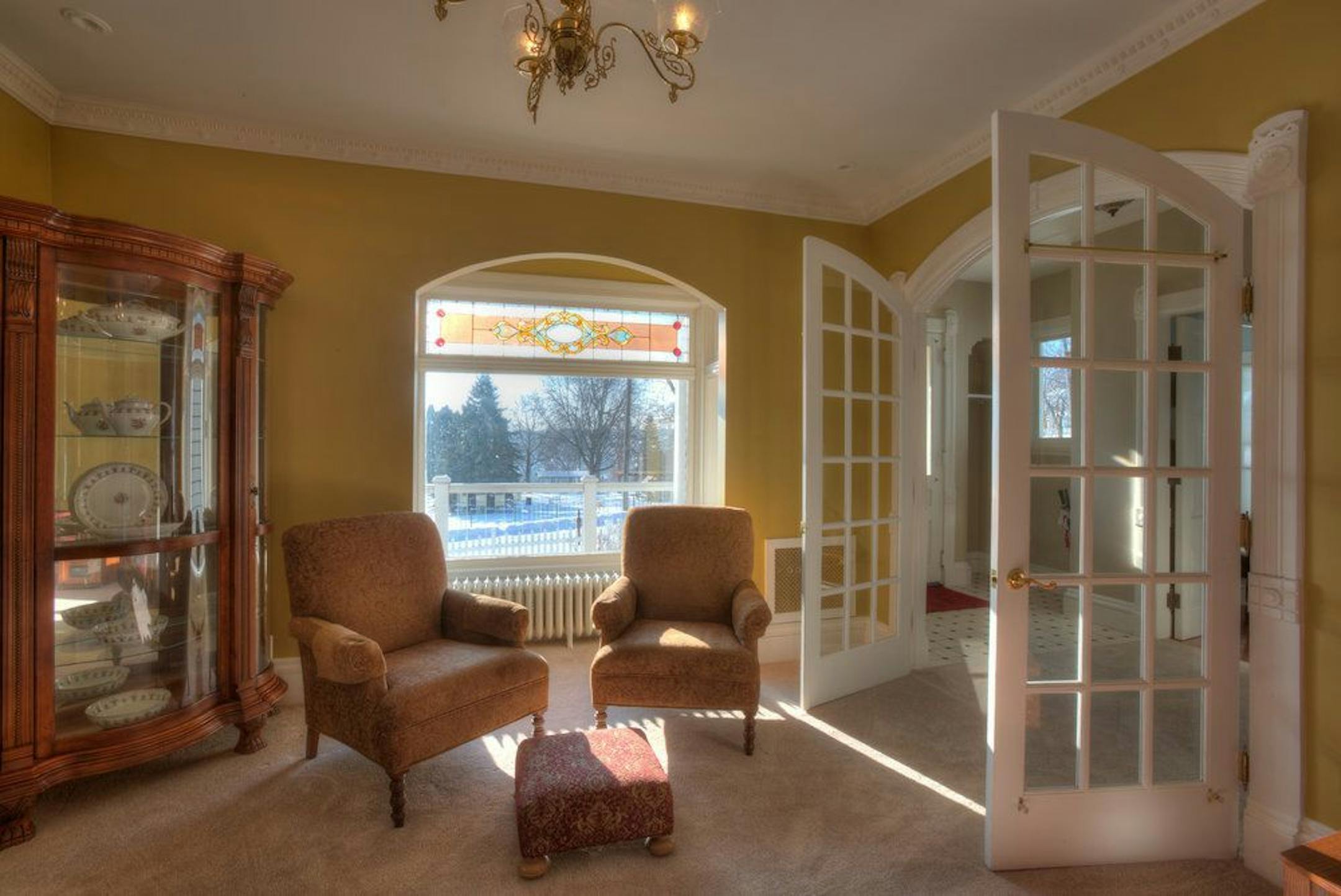 The parlor has a fireplace.