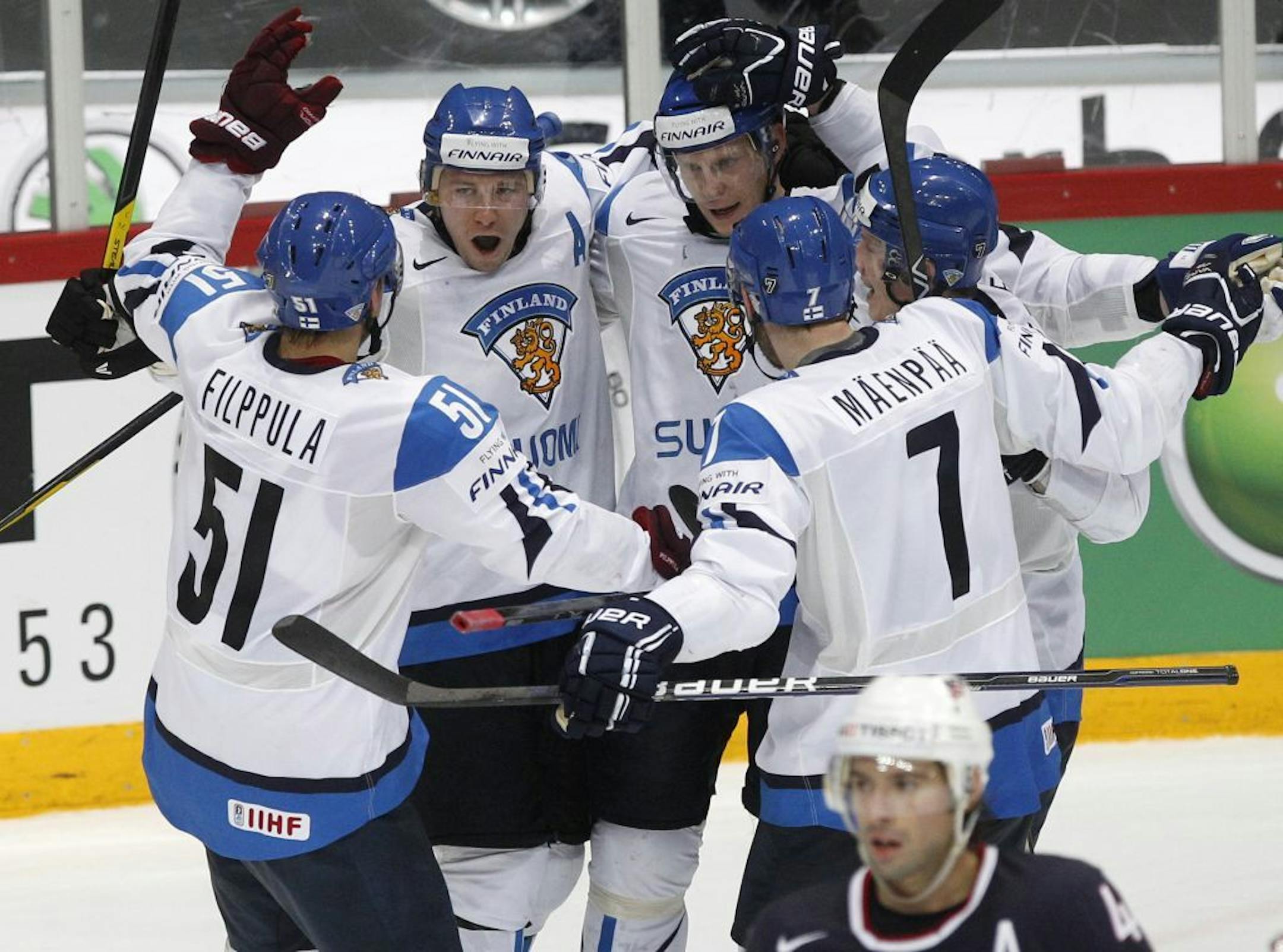 Finland players celebrate their goal against US during their Ice Hockey World Championships quarterfinal match at the Hartwall Arena in Helsinki, Finland, Thursday, May 17, 2012.