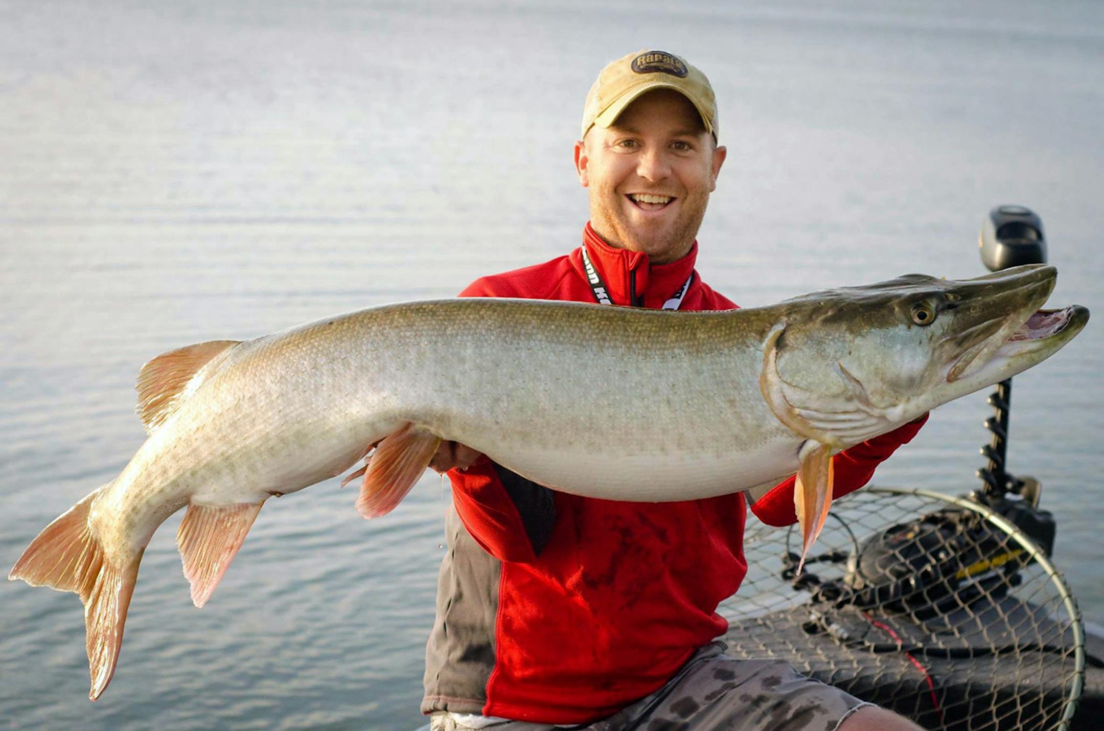Fishing guide Travis Frank holding a Muskie.