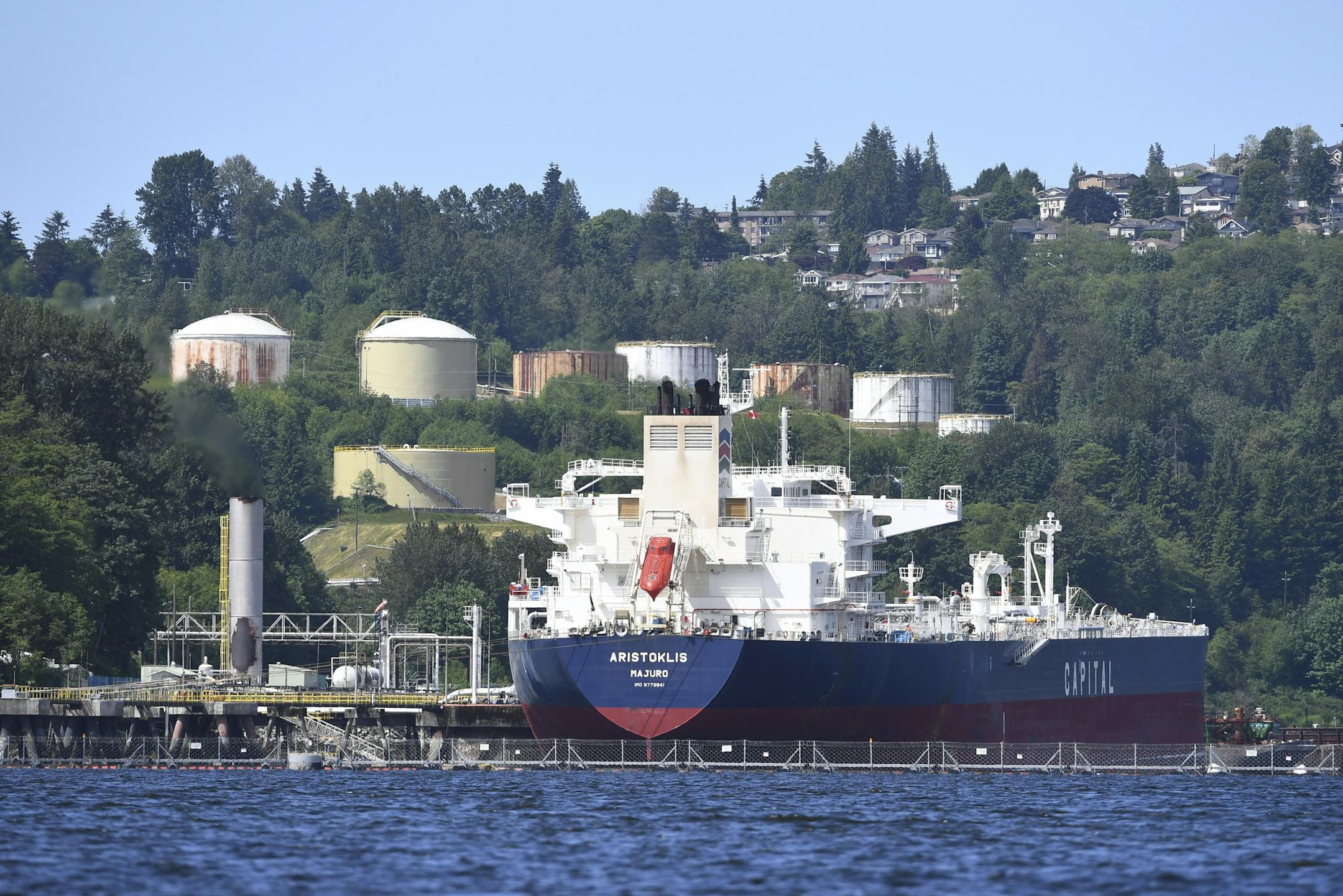 An oil tanker is moored at Kinder Morgan's Trans-Mountain marine terminal in Burnaby, British Columbia, Canada, Tuesday, May 29, 2018. Canadian Prime Minister Justin Trudeau's government announced plans Tuesday, May 29, 2018, to spend US$3.4 billion to purchase Kinder Morgan's Trans Mountain pipeline. (Jonathan Hayward/The Canadian Press via AP)