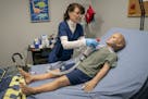 Nurse Heather Grace demonstrated how to change a tracheostomy tube on Pediatric Hal, a simulated 5-year-old patient who helps health care providers tr