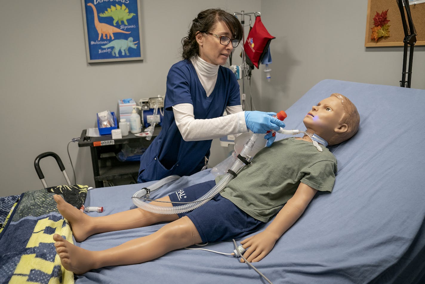 Nurse Heather Grace demonstrated how to change a tracheostomy tube on Pediatric Hal, a simulated 5-year-old patient who helps health care providers train for real-life scenarios.