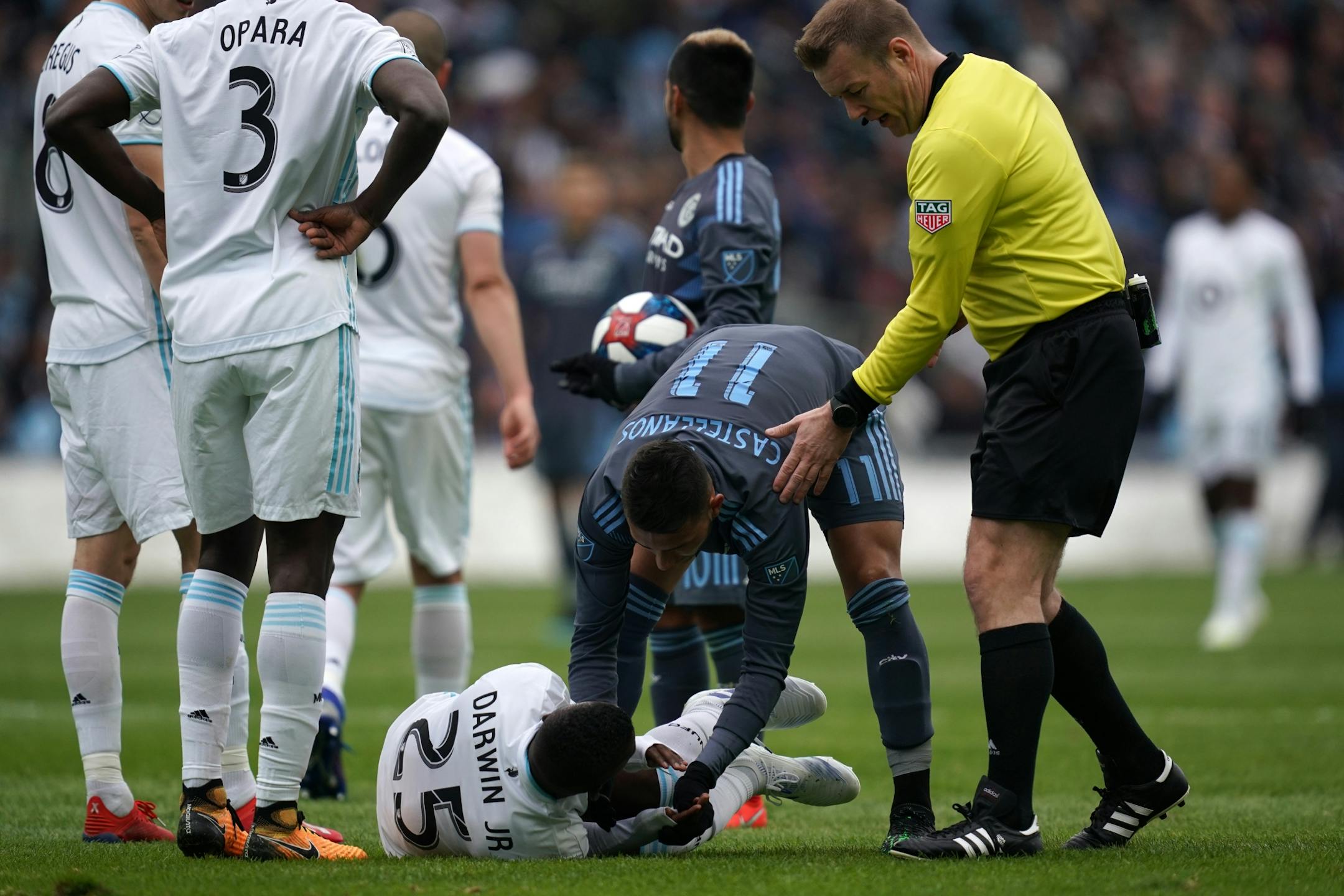 New York City defender Joe Scally (25) was helped by New York City midfielder Valentin Castellanos (11) after he collided with New York City midfielder Maximiliano Moralez (10) in the first half.
