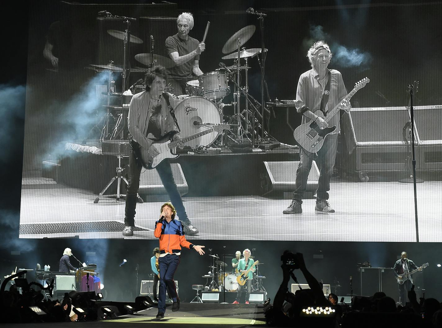 Mick Jagger of The Rolling Stones performs in front of a video monitor showing band mates, from left, Ron Wood, Charlie Watts and Keith Richards on day 1 of the 2016 Desert Trip music festival at Empire Polo Field on Friday, Oct. 7, 2016, in Indio, Calif. (Photo by Chris Pizzello/Invision/AP)