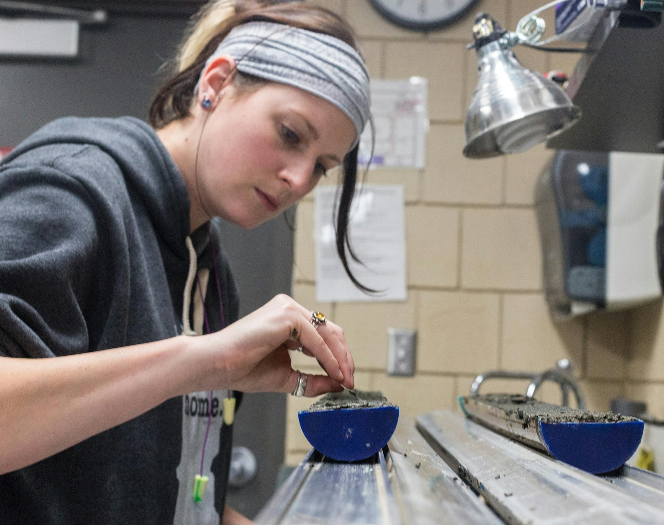 Cate Knudsen, St. Cloud State student, splits one of the Lake Victoria cores at the University of Minnesota, Feb. 25. Samples from Lake Victoria ] Elizabeth Brumley special to the Star Tribune * In recent weeks, a St. Cloud State University team took core samples from the lake bottom, which could provide a record of human settlement on the site
