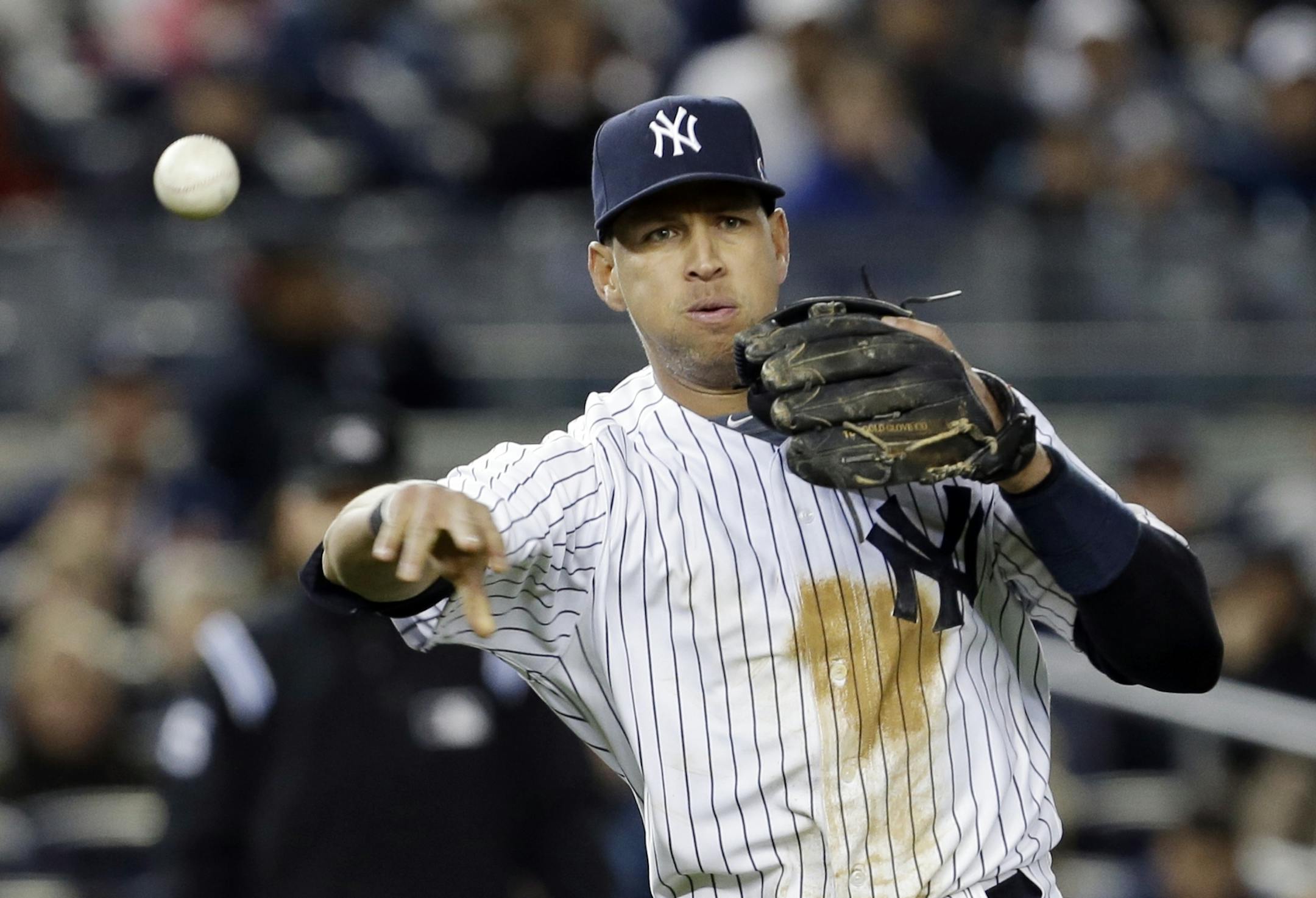 New York Yankees' Alex Rodriguez throws out Detroit Tigers' Andy Dirks in the second inning during Game 1 of the American League championship series Saturday, Oct. 13, 2012, in New York.