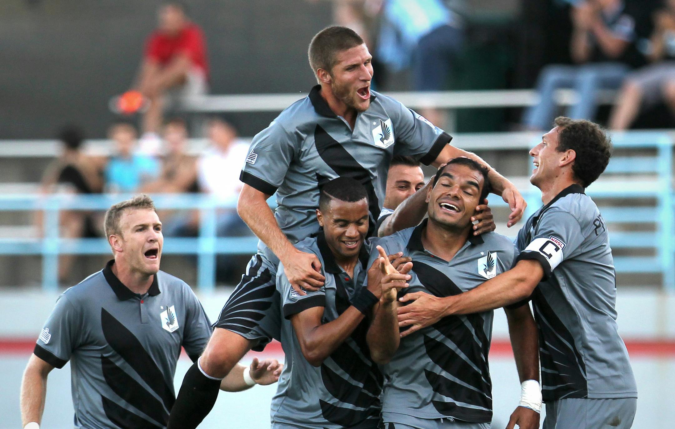 Minnesota's Pablo Campos (9) celebrates with teammates after his goal in the first half of the Tampa Bay Rowdies vs. Minnesota United FC soccer game at the National Sports Center in Blaine, Minn., on Saturday, August 17, 2013. Minnesota leads 1-0 at the half. ] (ANNA REED/STAR TRIBUNE) anna.reed@startribune.com (cq) ORG XMIT: MIN1308172019053848