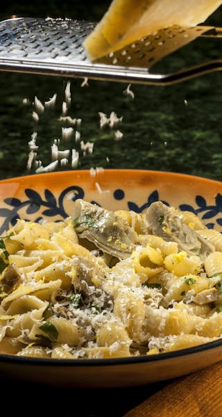 Lemon zest brightens the flavor while a little cream adds richness to this dish of pasta shells with artichokes. (Bill Hogan/Chicago Tribune/MCT) ORG 
