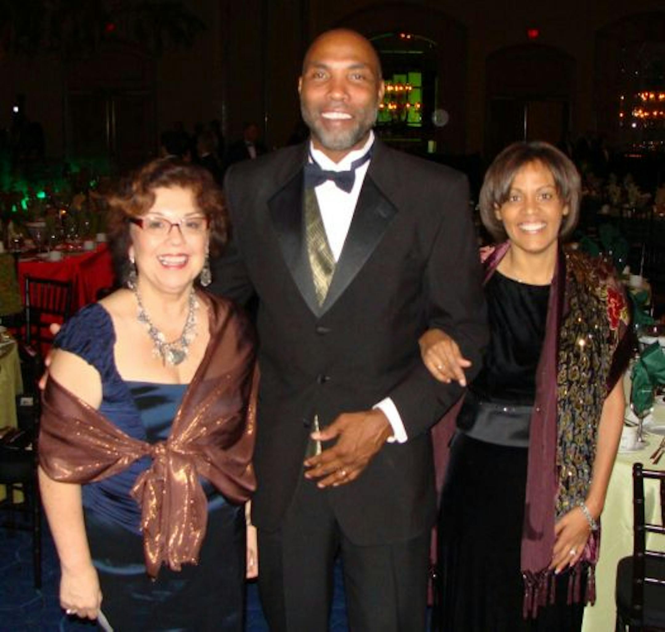 Sandy Vargas, president and CEO of the Minneapolis Foundation and Tony and Shelleye Williamson, owners of AJASA Technologies, Inc.